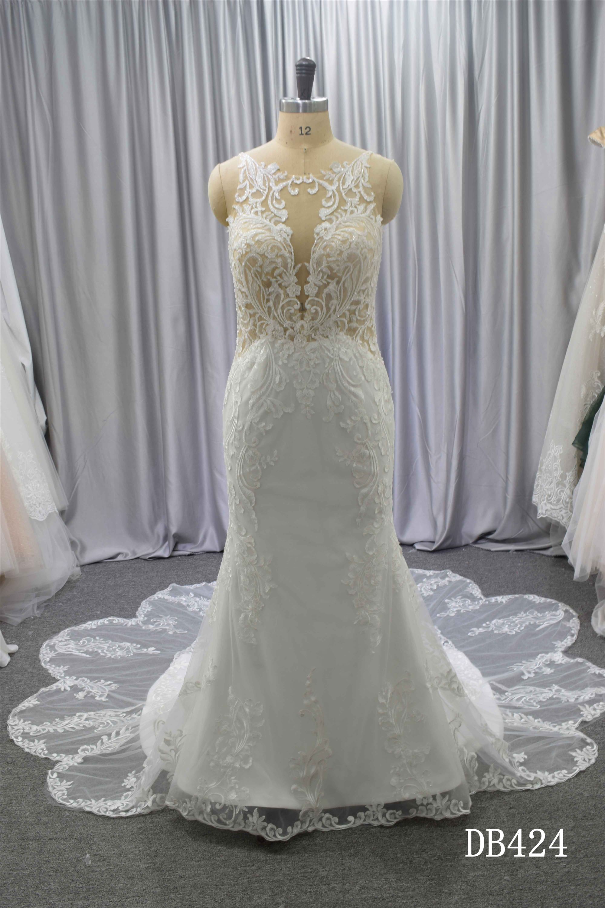 Illusion back wedding dress with curvy train